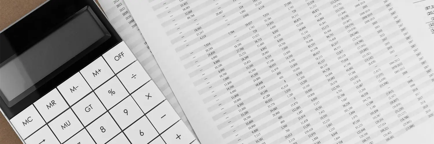 Calculator and financial statements representing accounting advisory